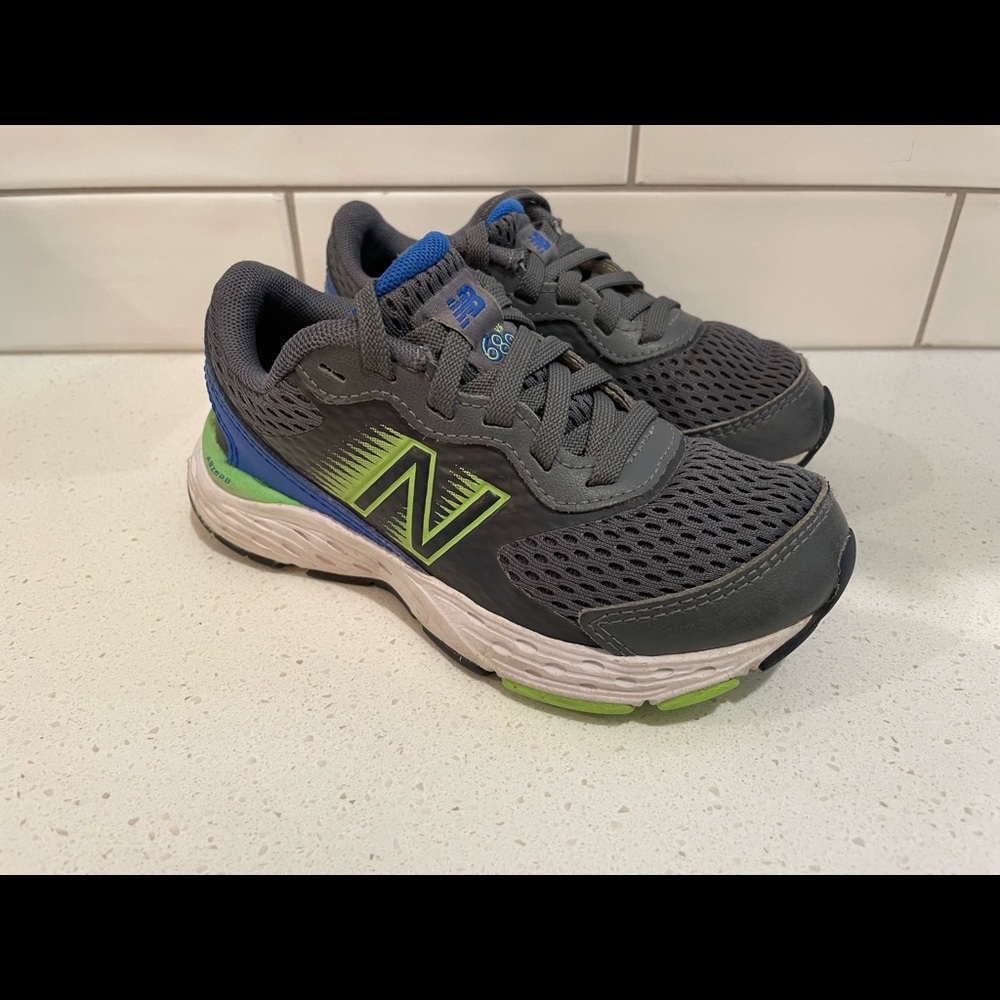 New Balance in gray, neon green and blue. Size 11C.